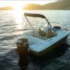 Jeanneau Cap Camarat 6.50 WA vue 3/4 arrière au coucher de soleil avec Mercury 150 — walkaround open 6m