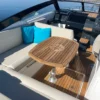 Parker 780 Escape cockpit avec table teck rose des vents et coussins turquoise Parker 780 Escape cockpit avec table teck rose des vents et coussins turquoise